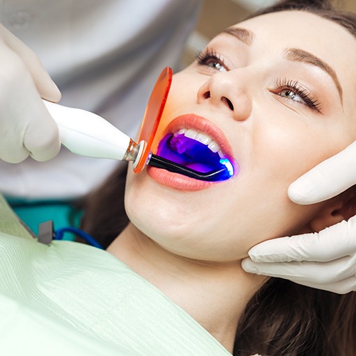 Patient receiving cosmetic dental bonding treatment