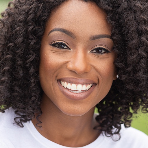 Woman with bright smile after teeth whitening
