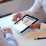 a patient filling out an insurance form