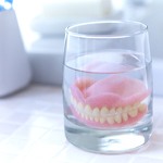Dentures in Fort Worth soaking in solution