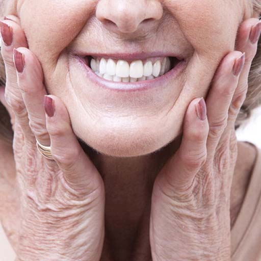 Closeup of woman smiling with dentures in Fort Worth