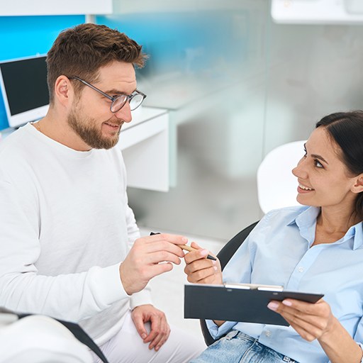 Patient learning the cost of tooth extractions in Fort Worth
