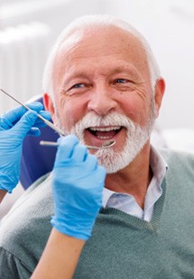 Mature man smiling during dental checkup