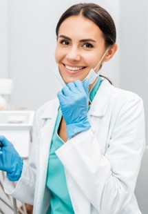 Dentist smiling at patient's dental exam