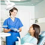 Patient in Fort Worth talking to dentist about dental implants