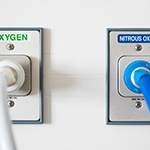 Oxygen and nitrous oxide outlets in a white wall
