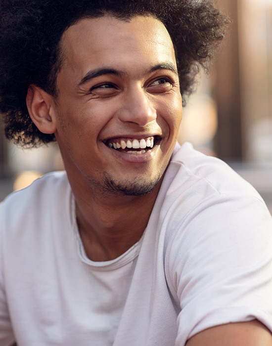 Man with healthy smile after gum disease treatment