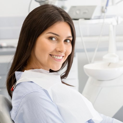 Woman in dental chair for dental checkups and teeth cleaning