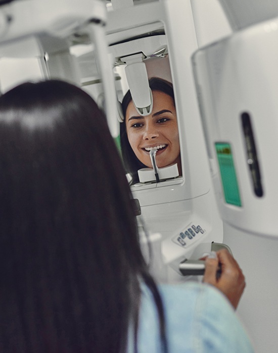 Woman receiving 3 D C T cone beam x-ray scan