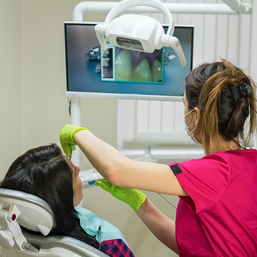 Dentist and patient looking at intraoral images