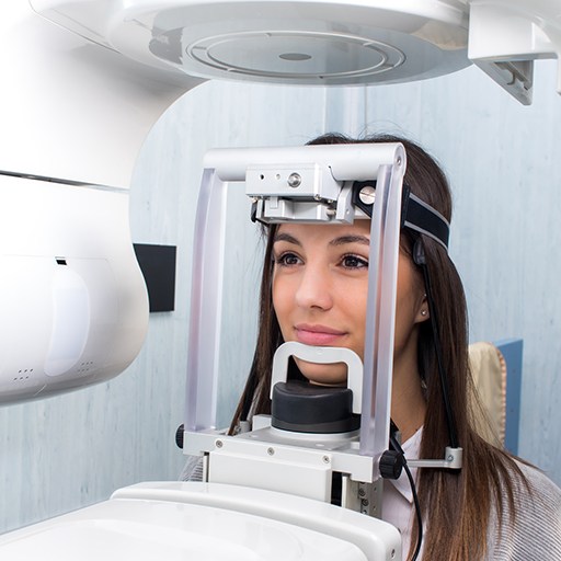 Woman receiving cone beam C T x-ray scans