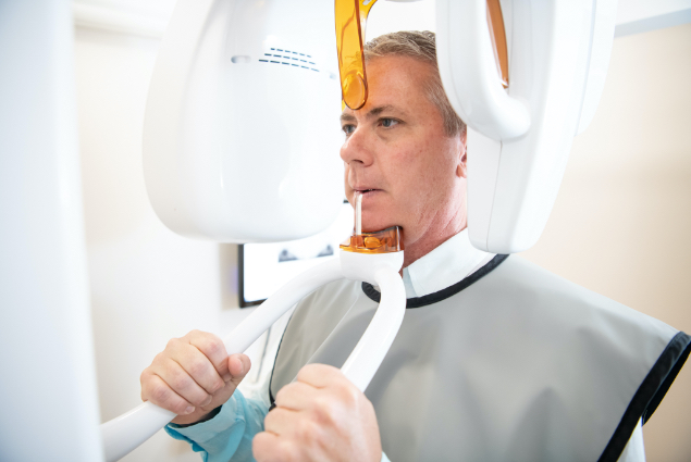 Man receiving 3 D C T cone beam X ray scan