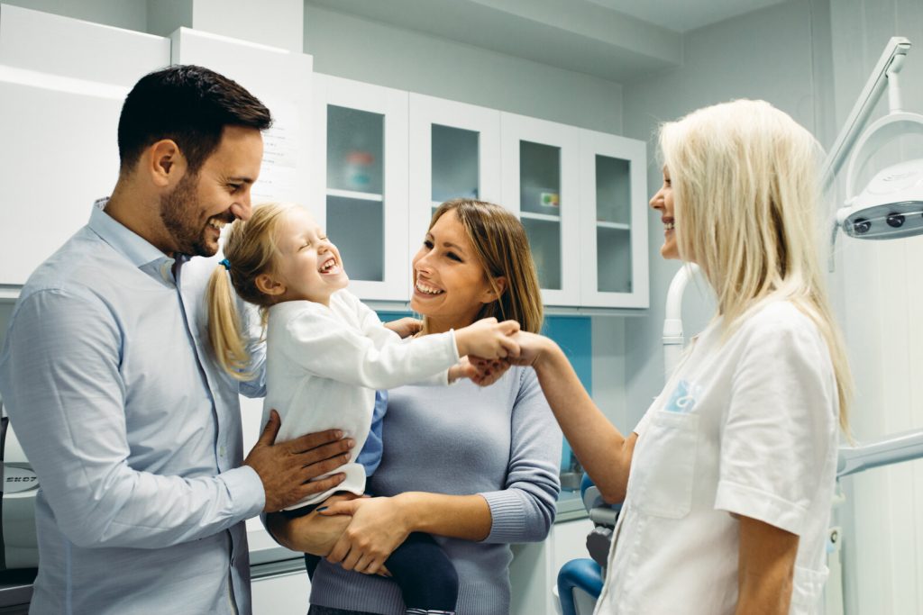 family at dentist after child knocked out a tooth in Fort Worth